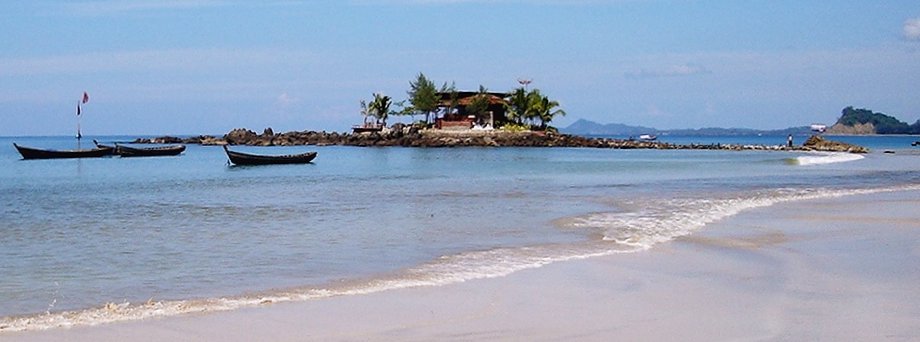 Fishing Boats and Islet off Ngapali Beach on the Bay of Bengal on the western coast of Myanmar / Burma