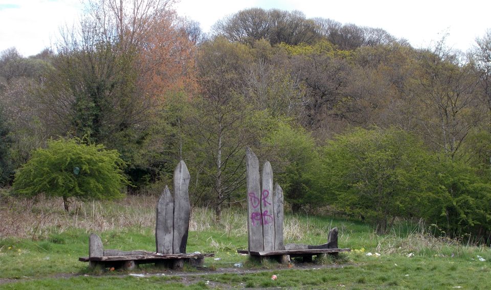 Antonine Wolf Bench in Garscadden Woods beneath Castle Hill